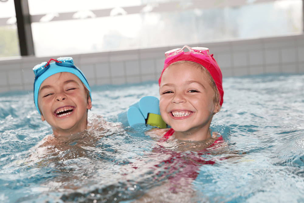 kids swimming in a pool