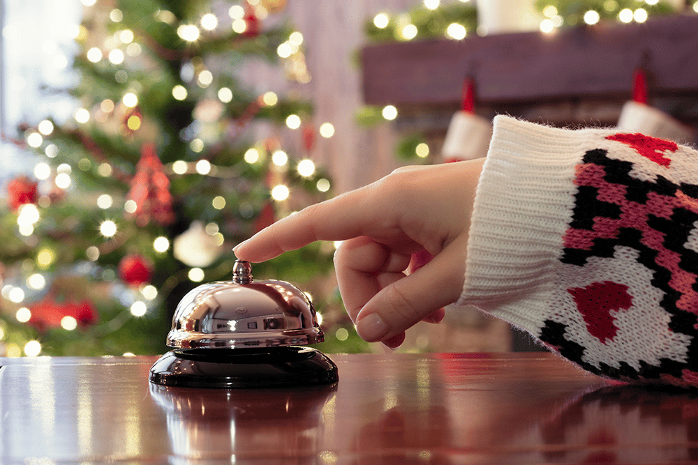 woman pressing hotel bell