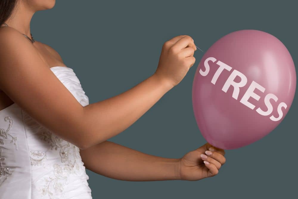 bride gets rid of stress and panic by popping balloon